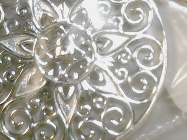 Sterling silver ornamental sol