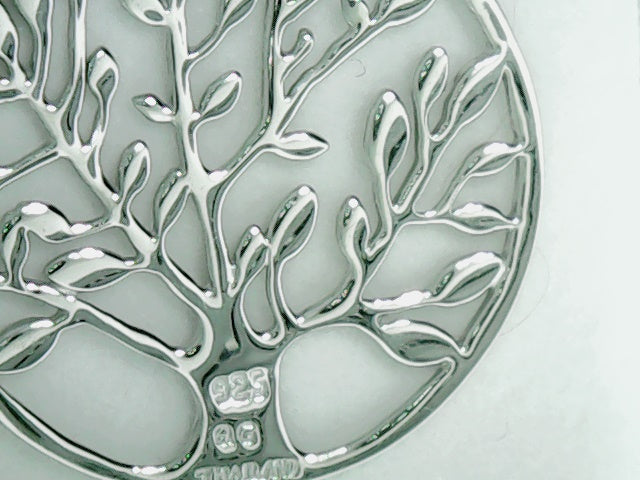 polished circle with tree